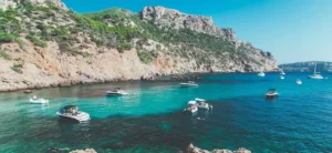 Boats on turquoise water in Mallorca, Spain