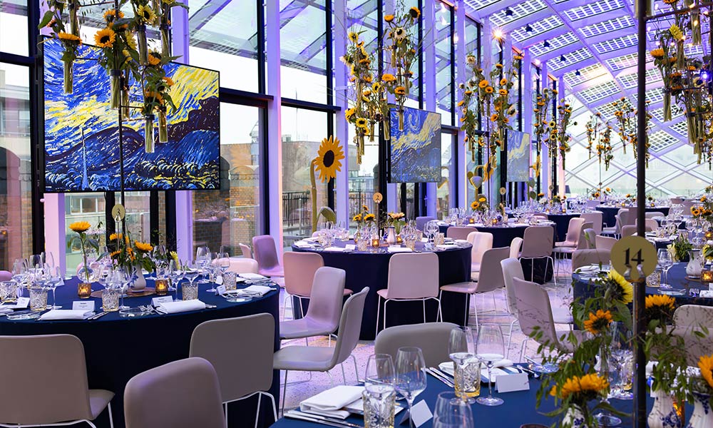 Corporate event dining sunflower theme glass venue
